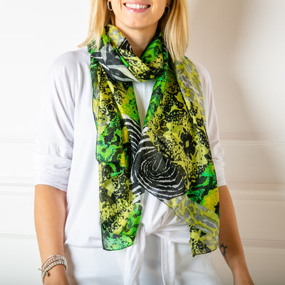 The green animal print 100% silk scarf which can be worn in many different ways